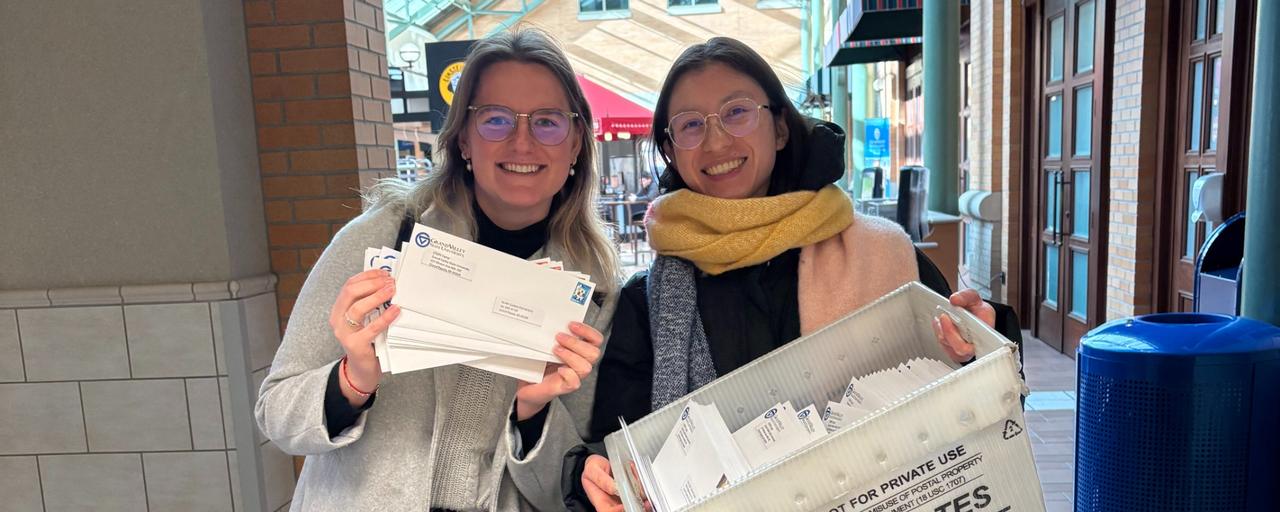 Female staff members at the post office sending out promotionals